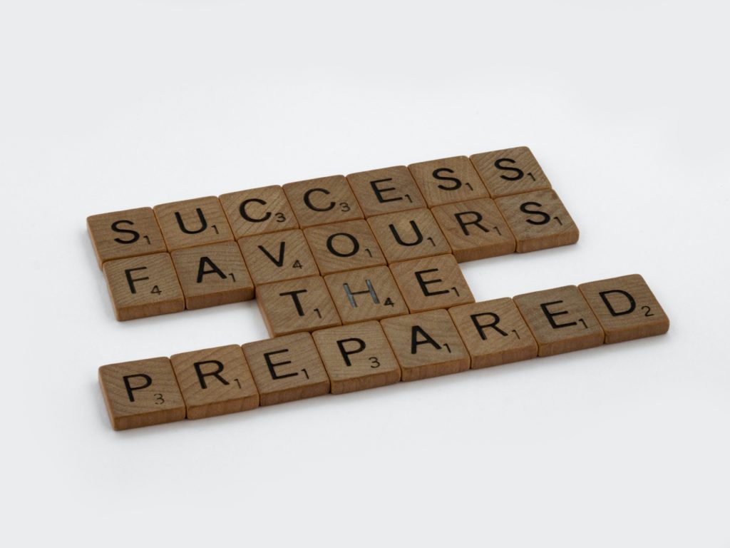  Scrabble tiles spelling the words: success favours the prepared.